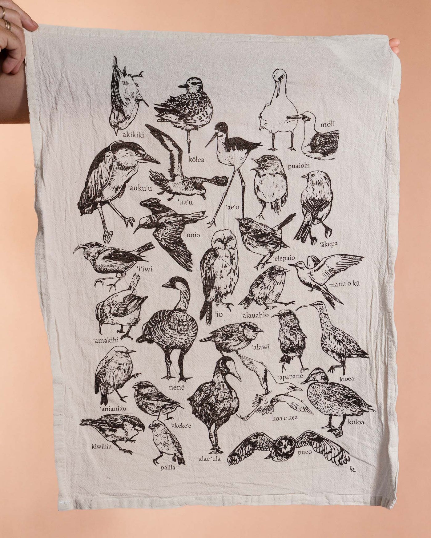 Beige tea towel with black line drawings of native Hawaiian birds