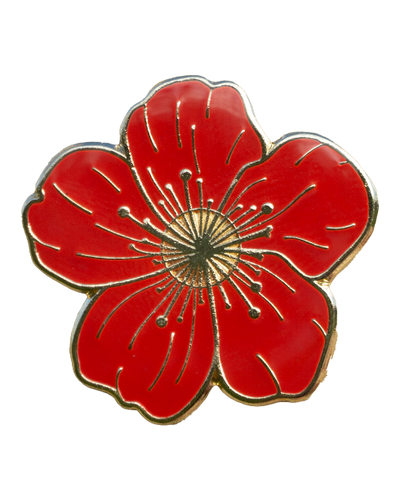 An enamel pin of a deep red flower with five broad petals.